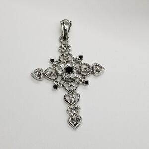 silver tone cross pendant with black and clear rhinestones